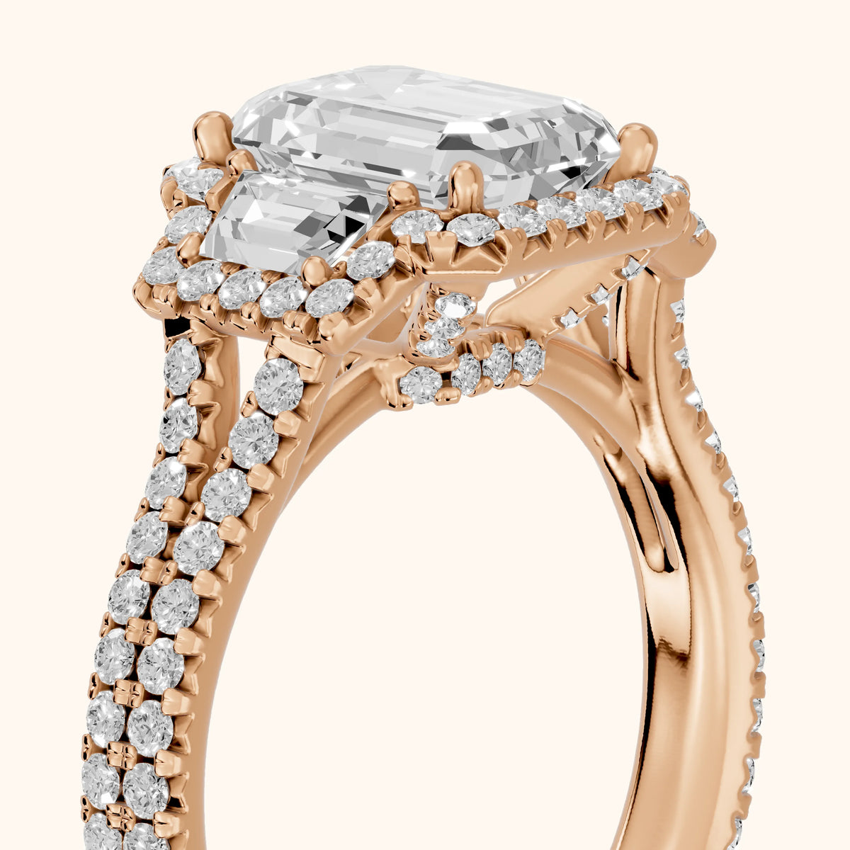 Ronan Three-Stone Halo Emerald Diamond Engagement Ring in Rose Gold - slant-view.webp
