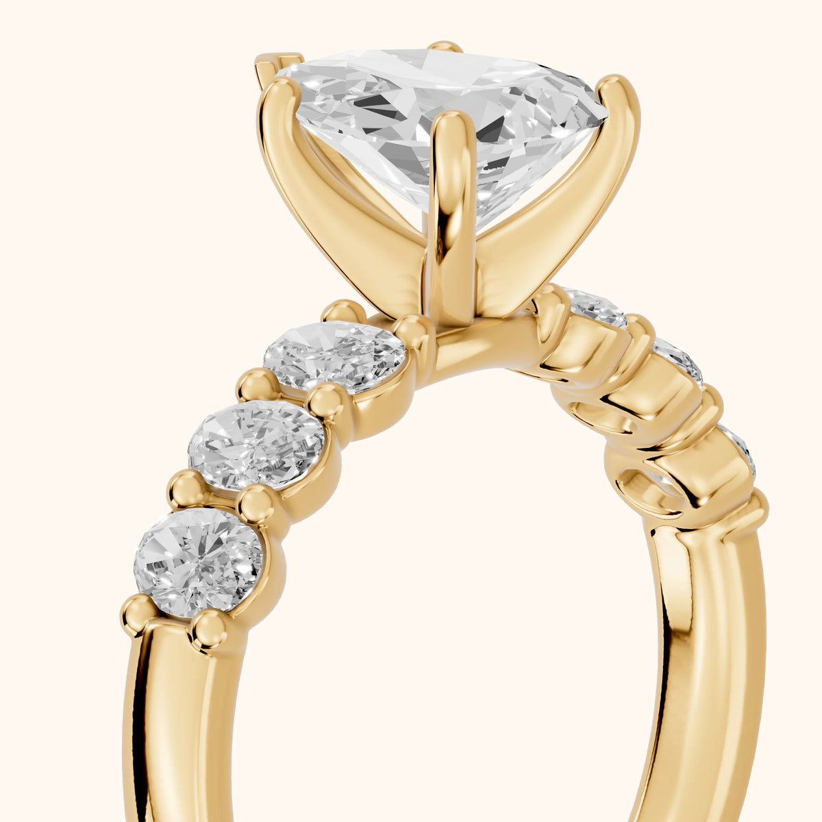 Kiera Graduated Seven-Stone Pear Diamond Engagement Ring in Yellow Gold - slant-view.webp