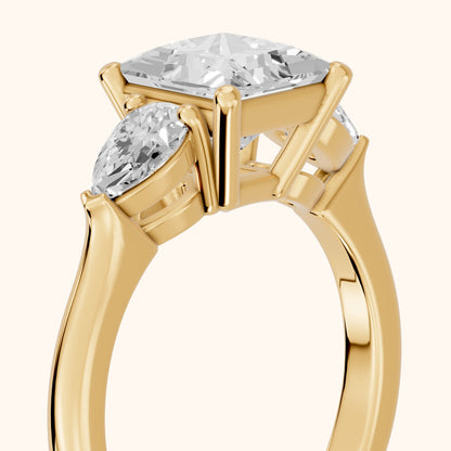 Mirabel Three-Stone Princess Diamond Engagement Ring in Yellow Gold - slant-view.webp