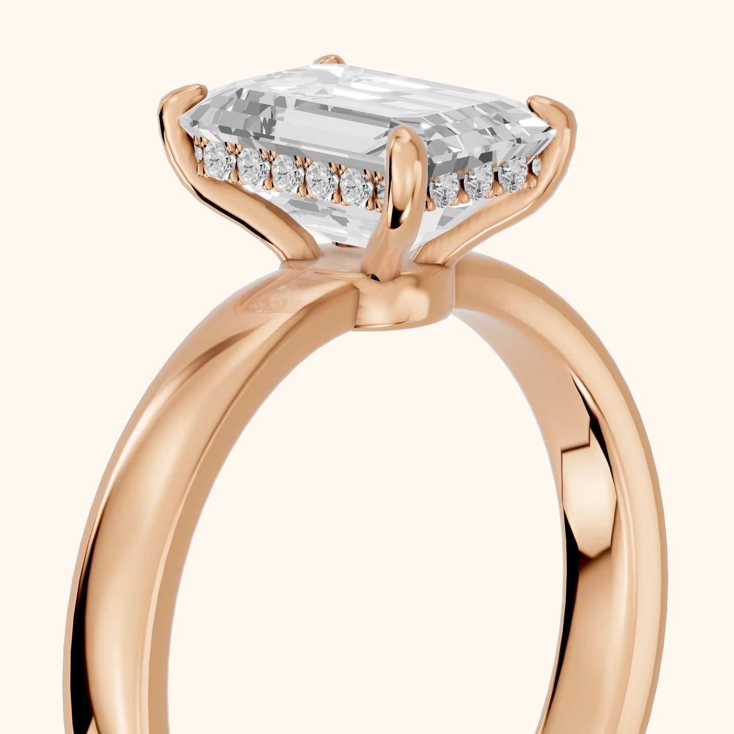 Lara Hidden Halo Emerald Diamond Engagement Ring in Rose Gold - slant-view.webp