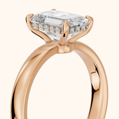Lara Hidden Halo Emerald Diamond Engagement Ring in Rose Gold - slant-view.webp