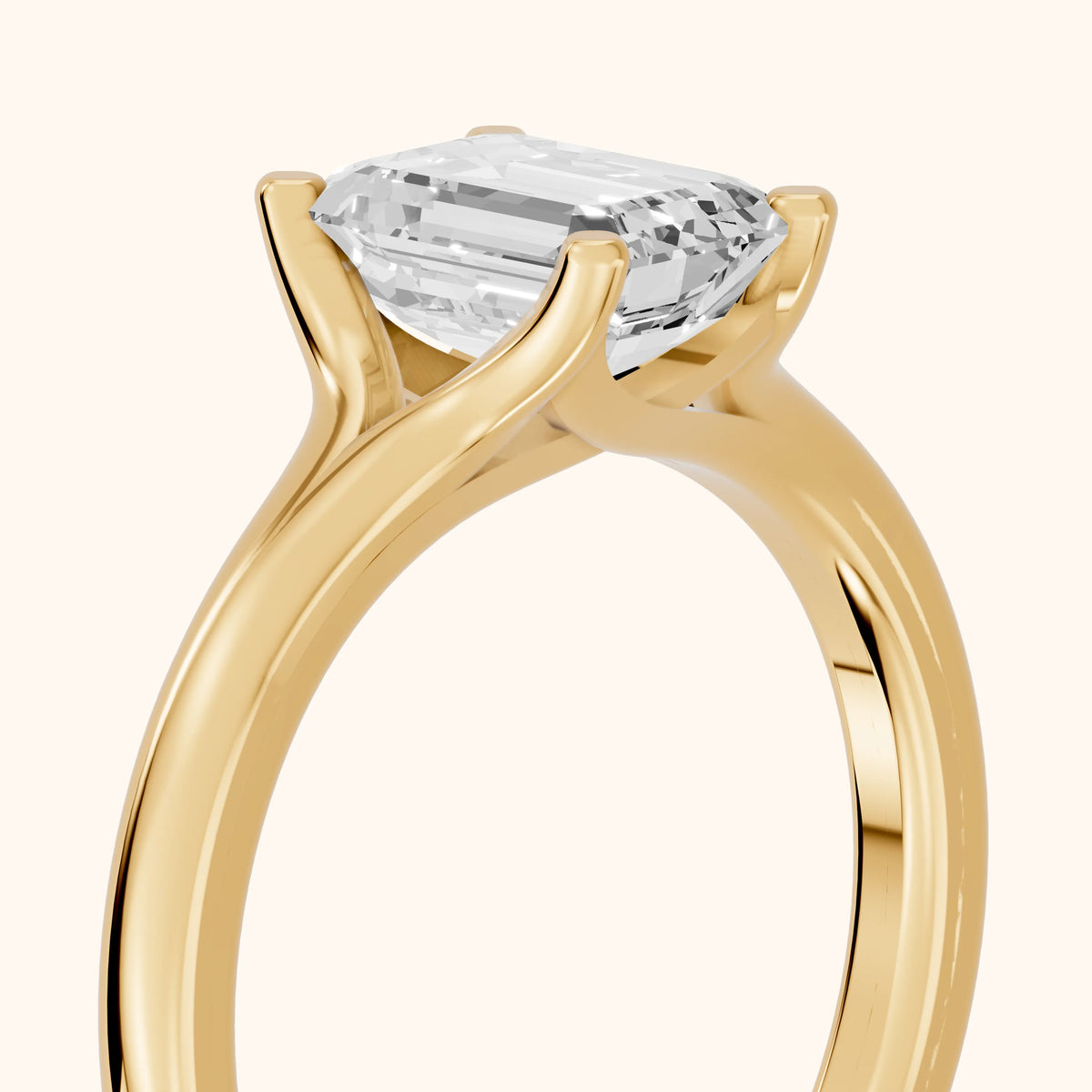 Nell Split Shank Solitaire Emerald Diamond Engagement Ring in Yellow Gold - slant-view.webp