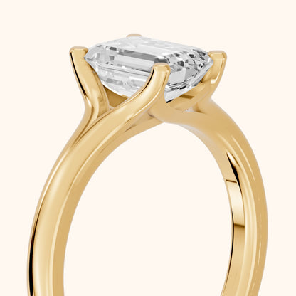Nell Split Shank Solitaire Emerald Diamond Engagement Ring in Yellow Gold - slant-view.webp