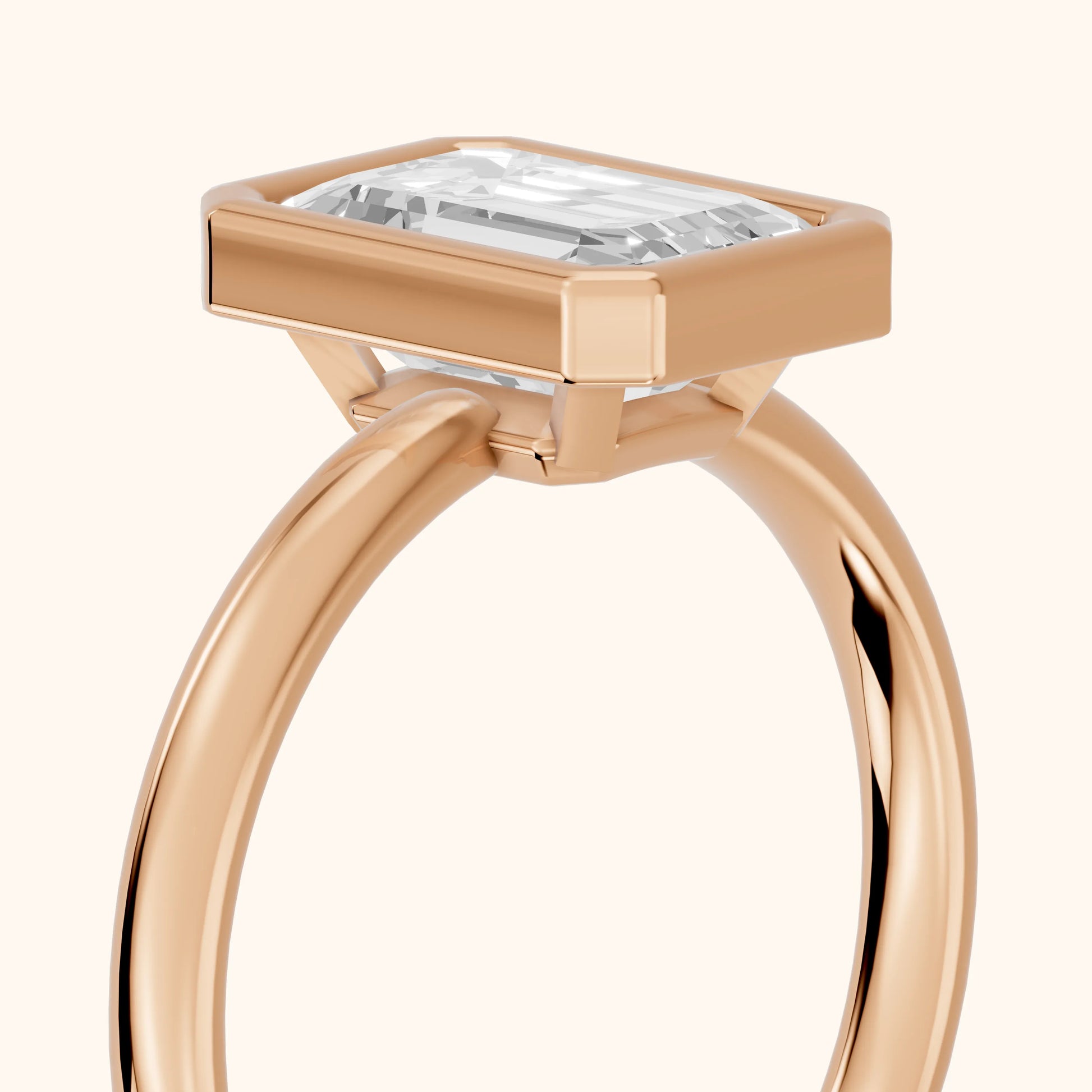 Maeve Bezel Solitaire Emerald Diamond Ring in Rose Gold - slant-view.webp
