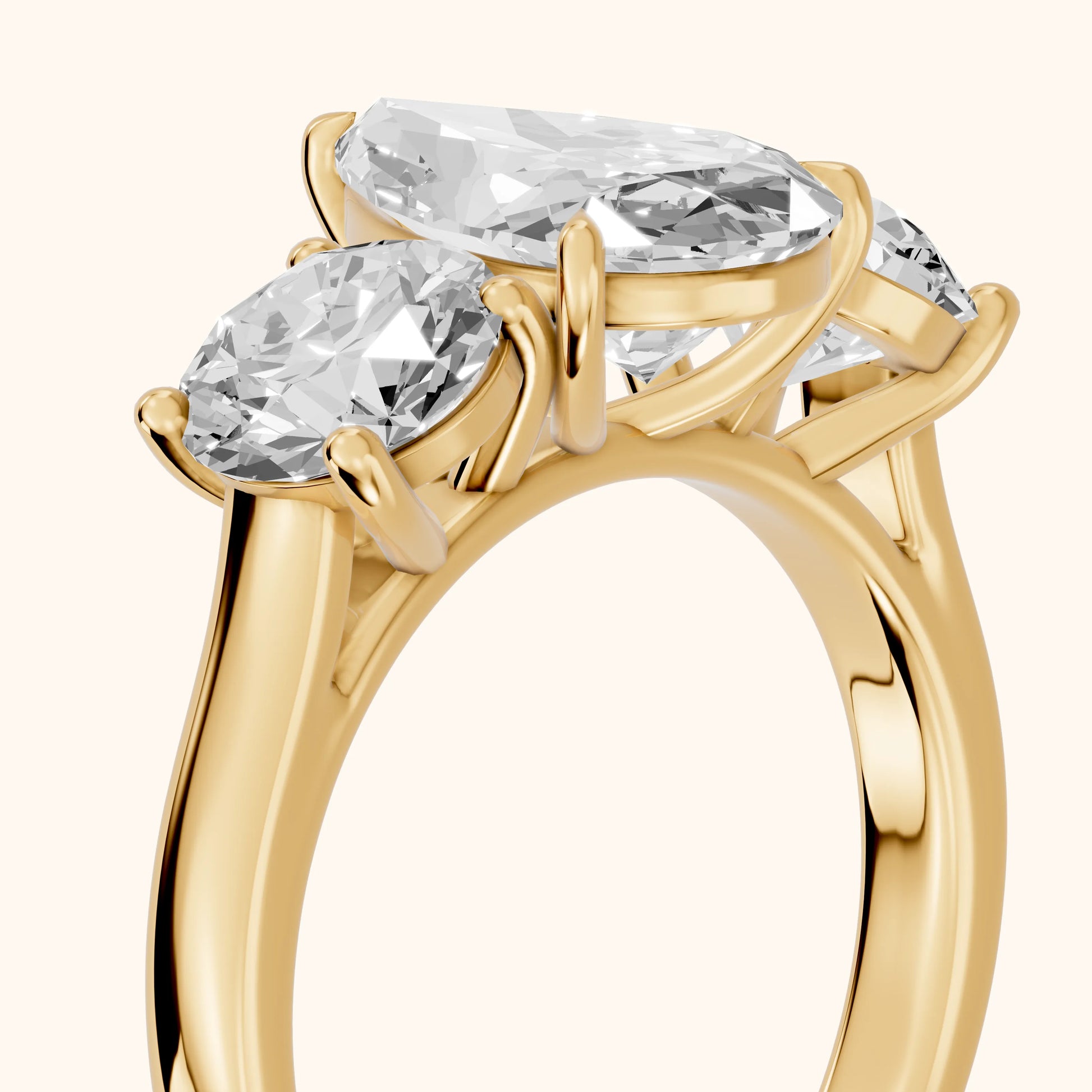 Esme Three-Stone Tapered Pear Diamond Ring in Yellow Gold - slant-view.webp