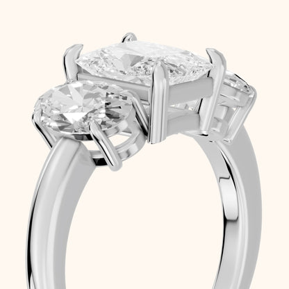 Lila Three-Stone Radiant Diamond Engagement Ring in Platinum - slant-view.webp