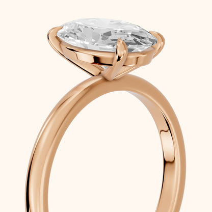 Lyla Petite Solitaire Oval Diamond Engagement Ring in Rose Gold - slant-view.webp