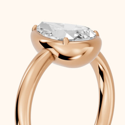 Alina Bezel Solitaire Pear Diamond Ring in Rose Gold - slant-view.webp