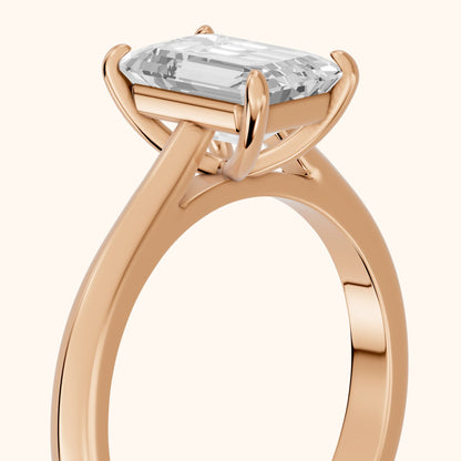 Kalia Knife Edge Solitaire Emerald Diamond Engagement Ring in Rose Gold - slant-view.webp