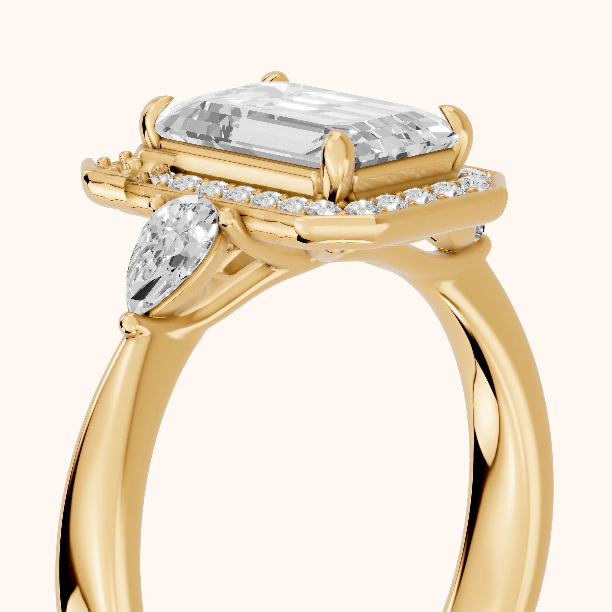 Eliza Halo Sidestone Emerald Diamond Engagement Ring in Yellow Gold - slant-view.webp