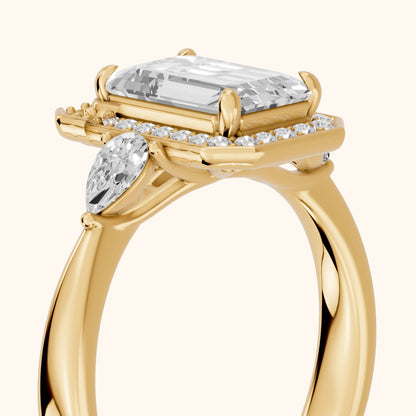 Eliza Halo Sidestone Emerald Diamond Engagement Ring in Yellow Gold - slant-view.webp