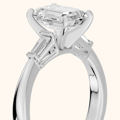Jacinta Baguette Three-Stone Emerald Diamond Engagement Ring in Platinum - slant-view.webp