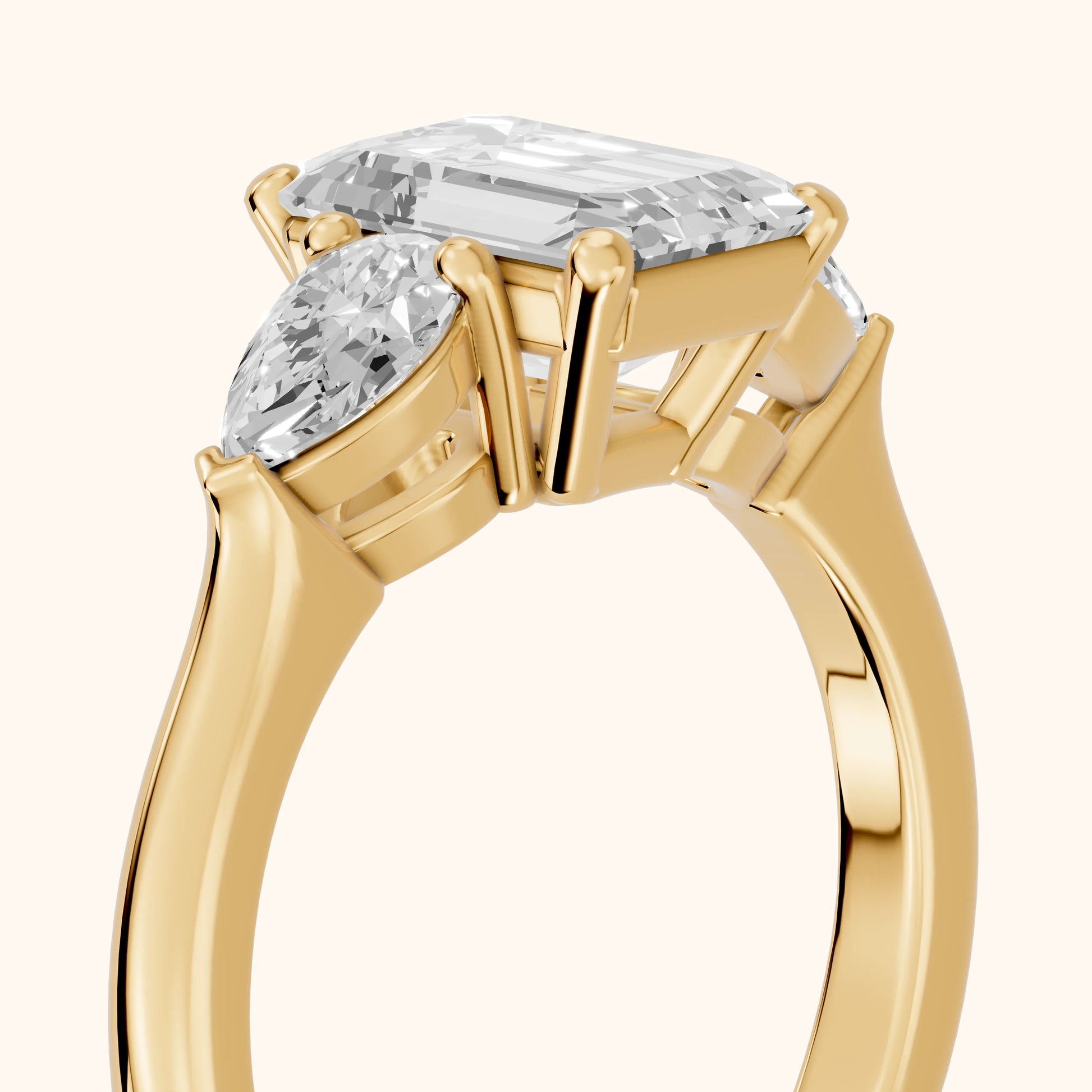 Mirabel Three-Stone Emerald Diamond Engagement Ring in Yellow Gold - slant-view.webp