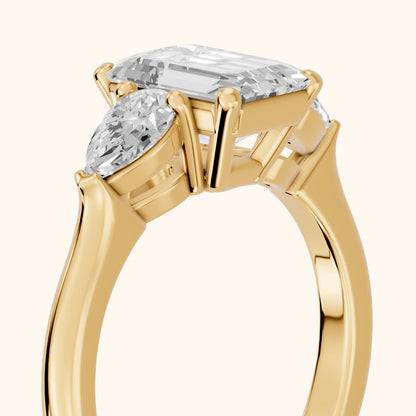 Mirabel Three-Stone Emerald Diamond Engagement Ring in Yellow Gold - slant-view.webp