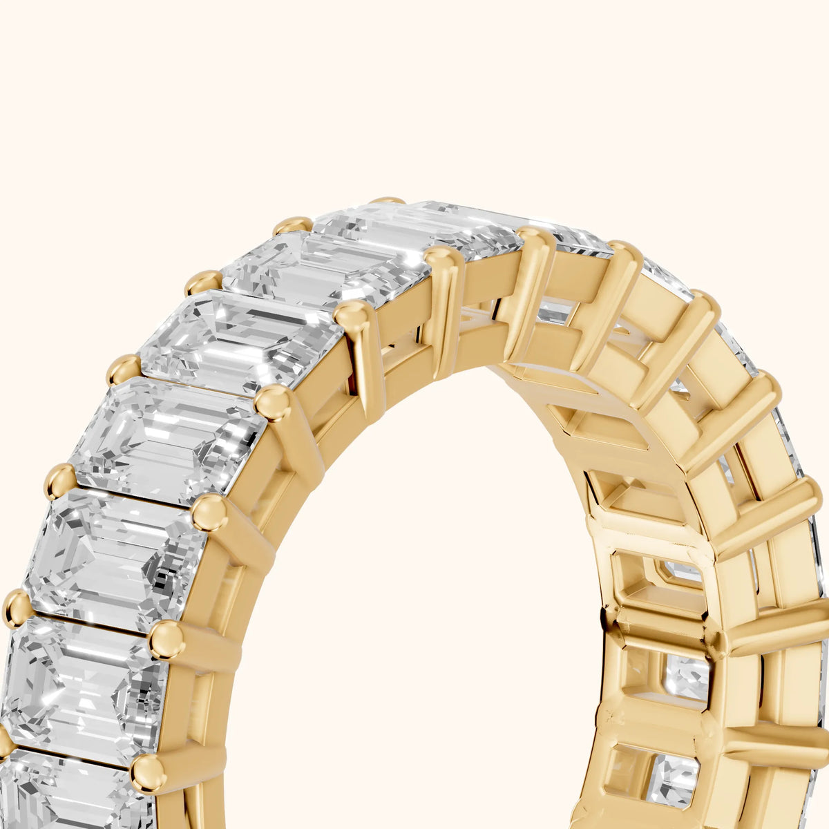 Callia Shared Prong Emerald Diamond Eternity Band in Yellow Gold - slant-view
