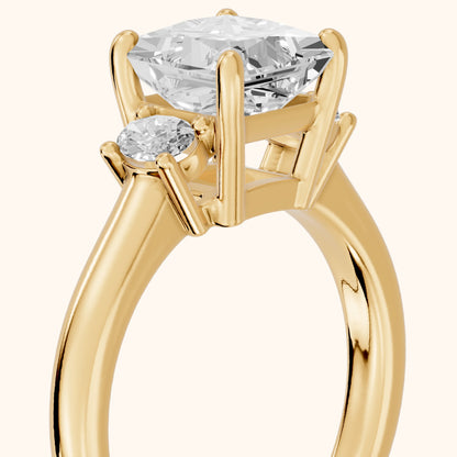 Alya Three-Stone Cathedral Princess Diamond Engagement Ring in Yellow Gold - slant-view.webp