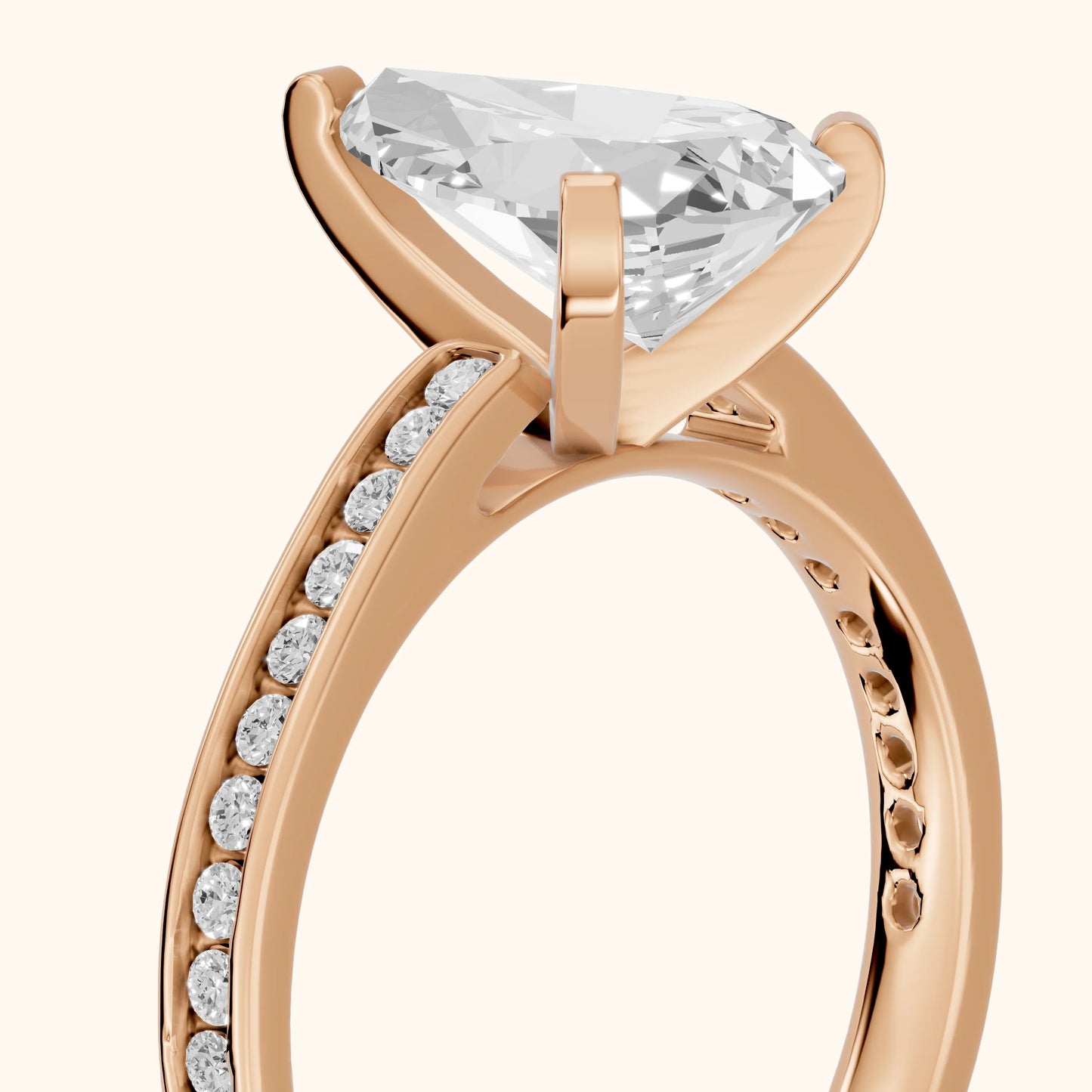 Tessa Solitaire Channel Set Pear Diamond Engagement Ring in Rose Gold - slant-view.webp