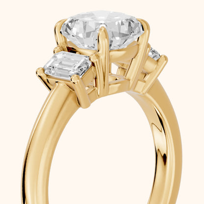 Babette Deco Three-Stone Cushion Diamond Engagement Ring in Yellow Gold - slant-view.webp