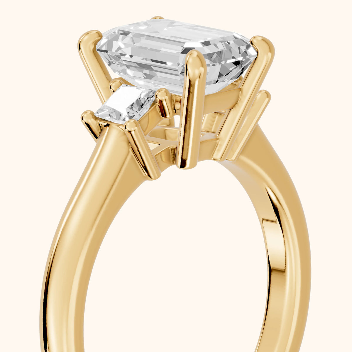 Brenna Three-Stone Emerald Diamond Engagement Ring in Yellow Gold - slant-view.webp