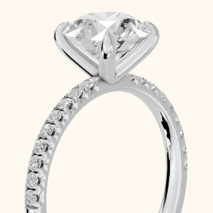 Ione Solitaire Pavé Round Diamond Engagement Ring in White Gold - slant-view.webp